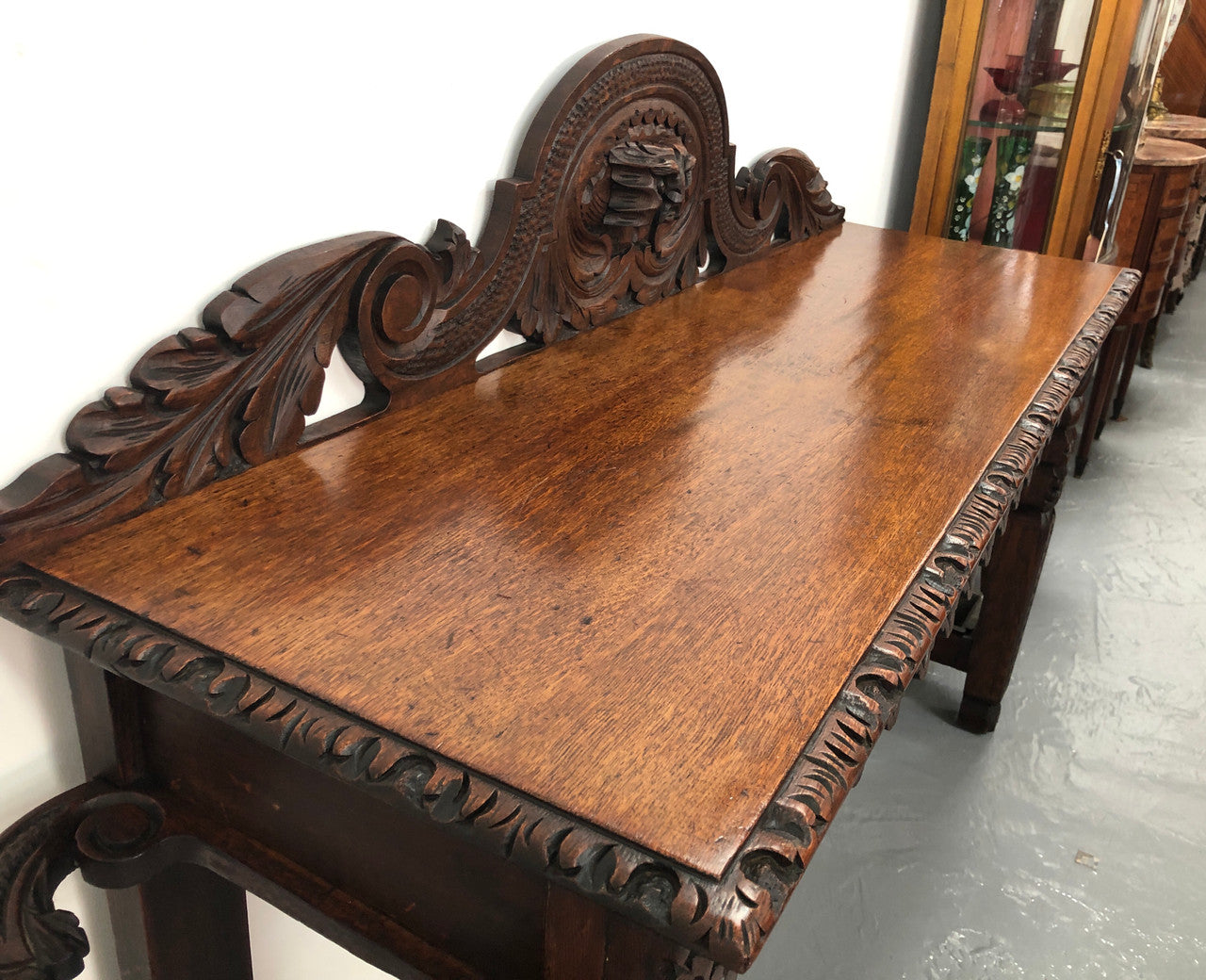 Superb 19th Century Gothic style hall/console table. It has umbrella and walking stick holders on both sides. In good original detailed condition.