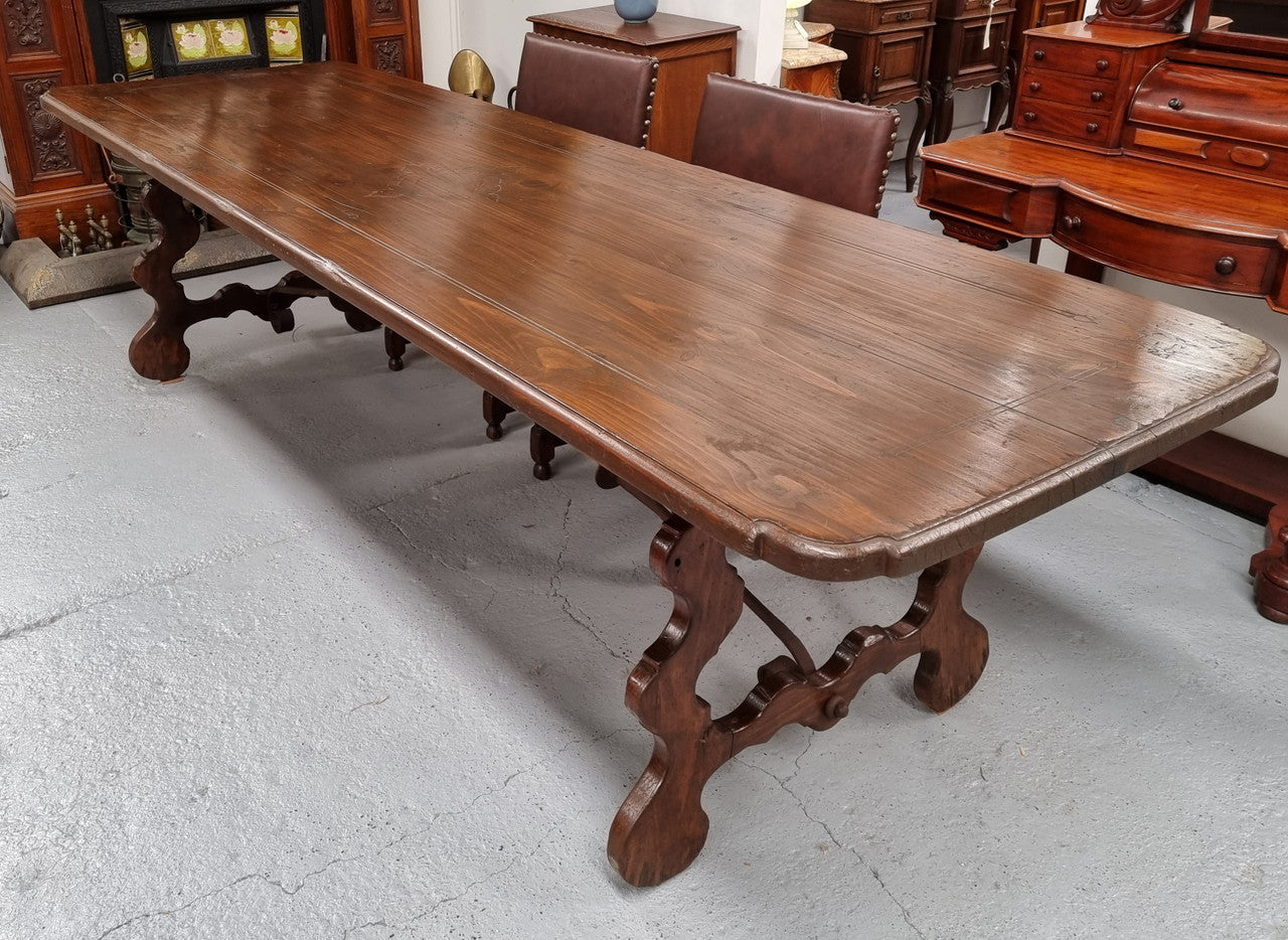 Amazing hard to find French Fruitwood Spanish style 3 meter dining table. Decorative iron work underneath and in good detailed original condition.