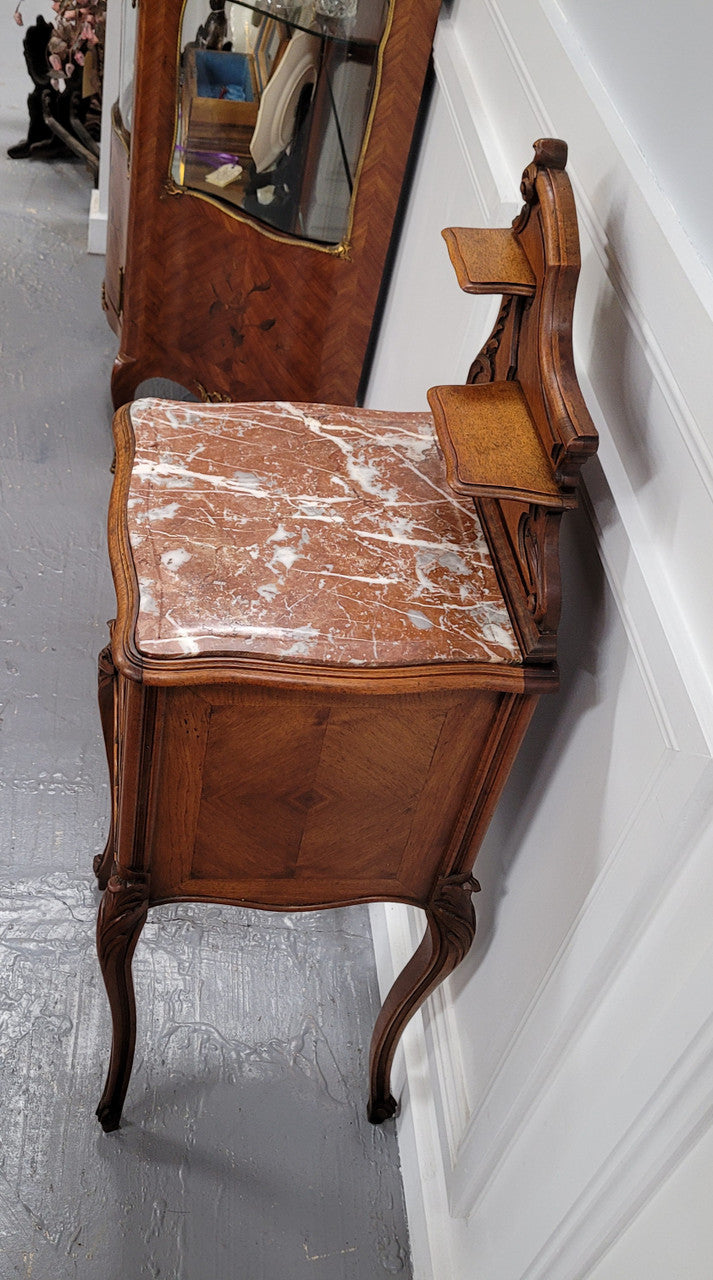 French Louis XV style Walnut single bedside cupboard with inset marble top. It has been sourced from France and is in good original detailed condition.