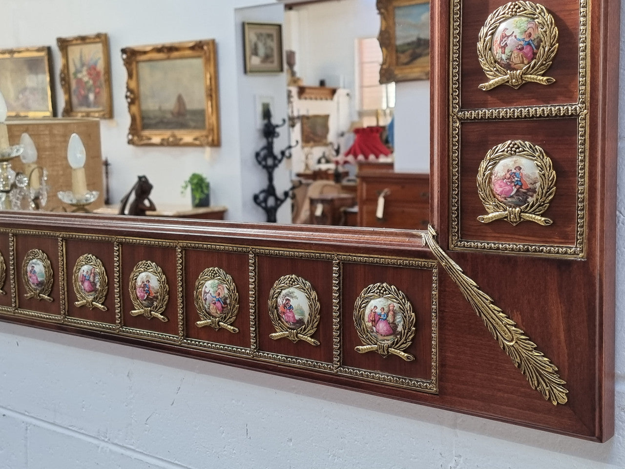 Vintage Mahogany marble top console table with matching mirror. Both with inset limoge panels surrounded by gilt brass. Highly decorative and in good original detailed condition. Circa 1950.