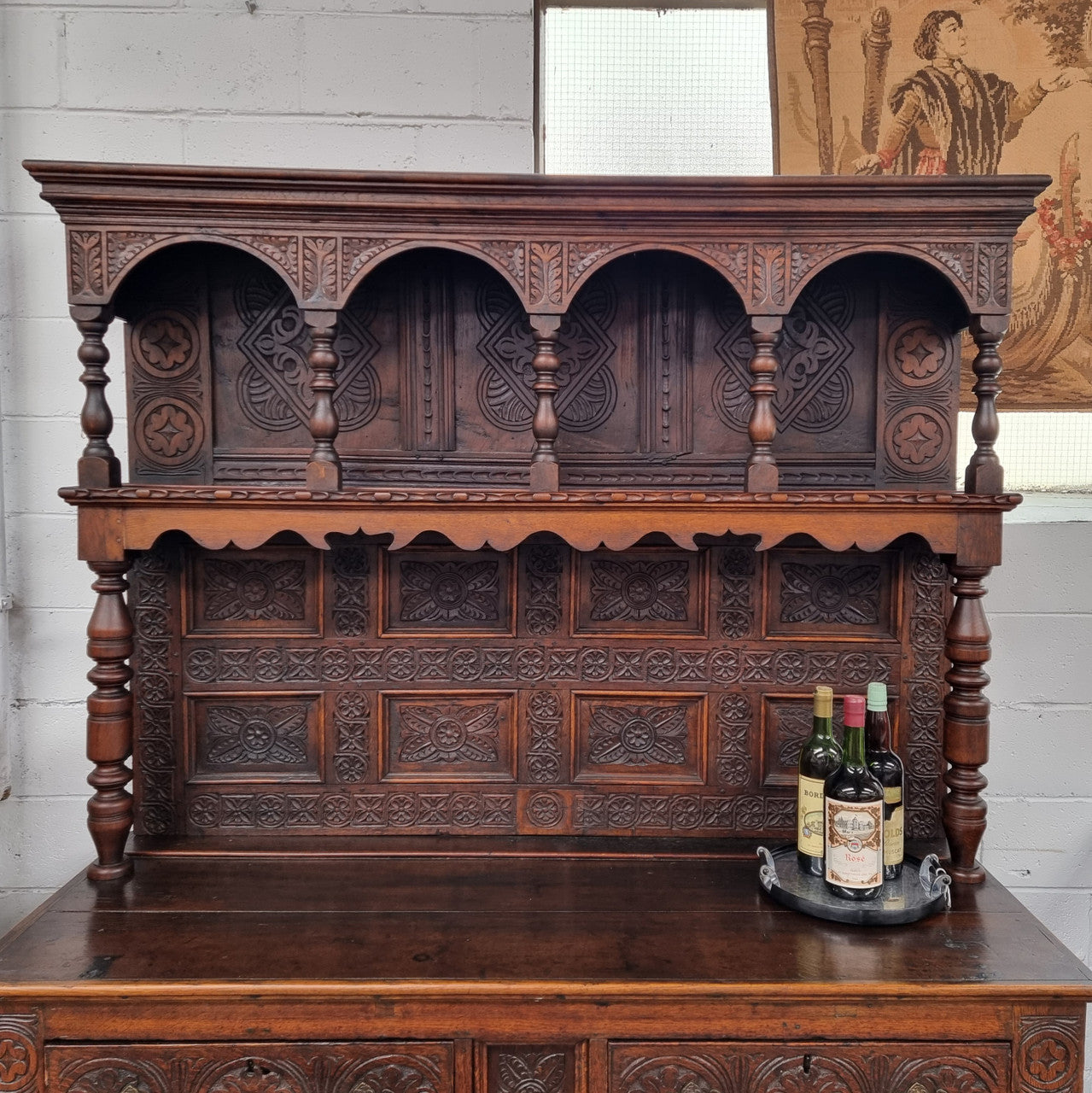 Impressively carved 18th Century English Oak kitchen dresser in 17th Century Jacobean style. It is in good original detailed condition and has been sourced from France.