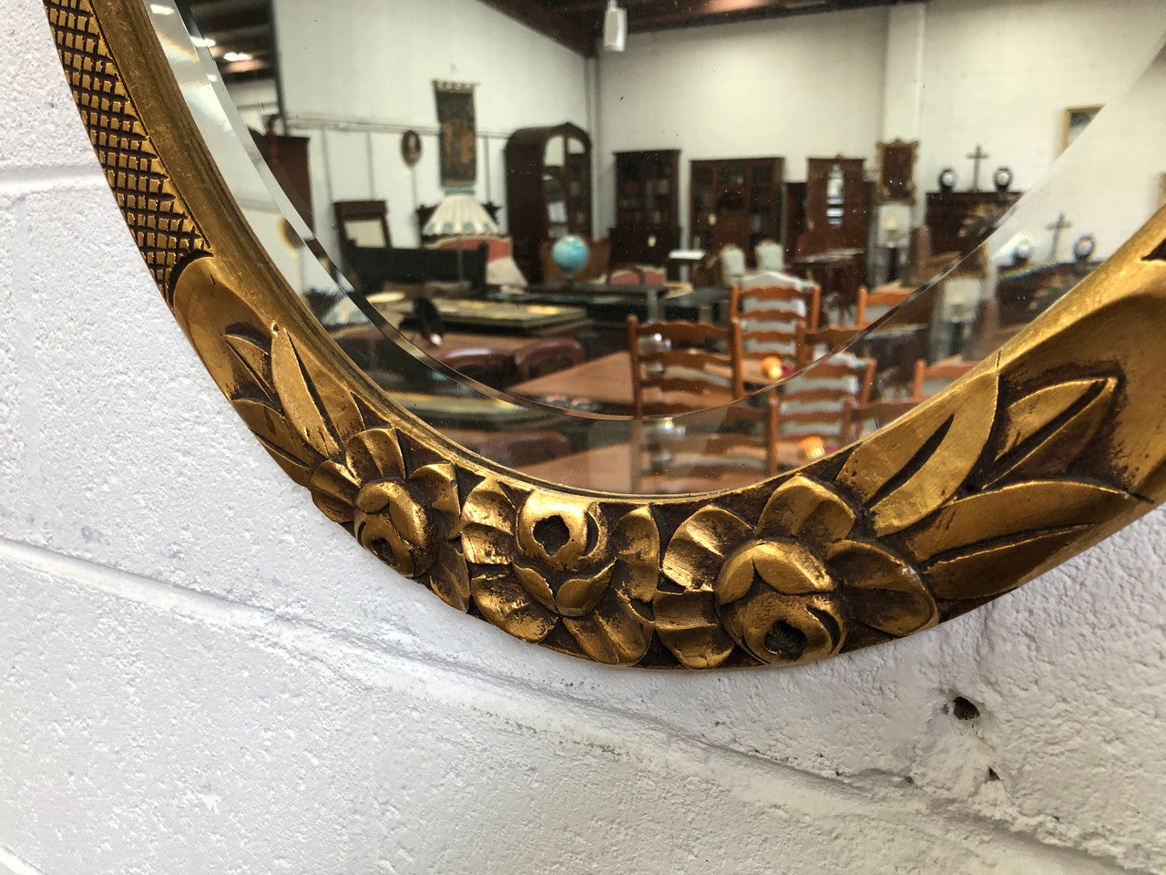 Beautiful French decorative Art Deco giltwood wall mirror with lovely floral detail. Contains its original mirror and is in good original condition.