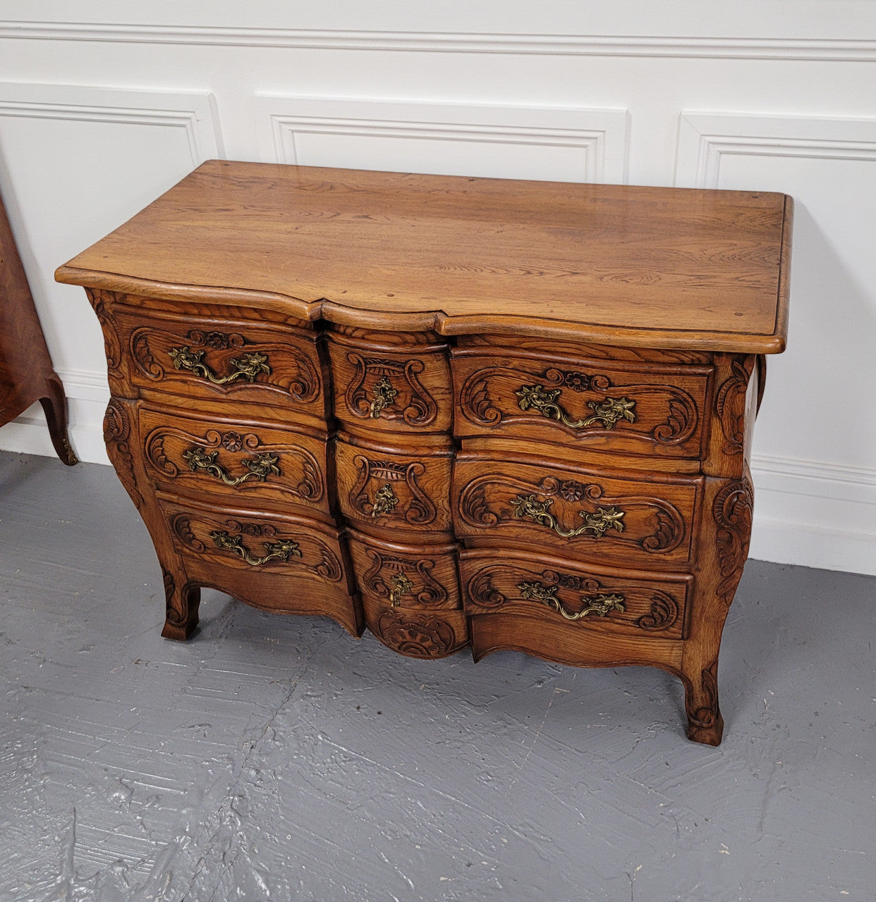 French Antique Louis XIV style Oak wooden top commode. It has a stunning serpentine bombe shape front along with amazing handles and carvings. It comes with three beautiful keys as pictured and comes with working locks. It has been sourced from France and in good original detailed condition.