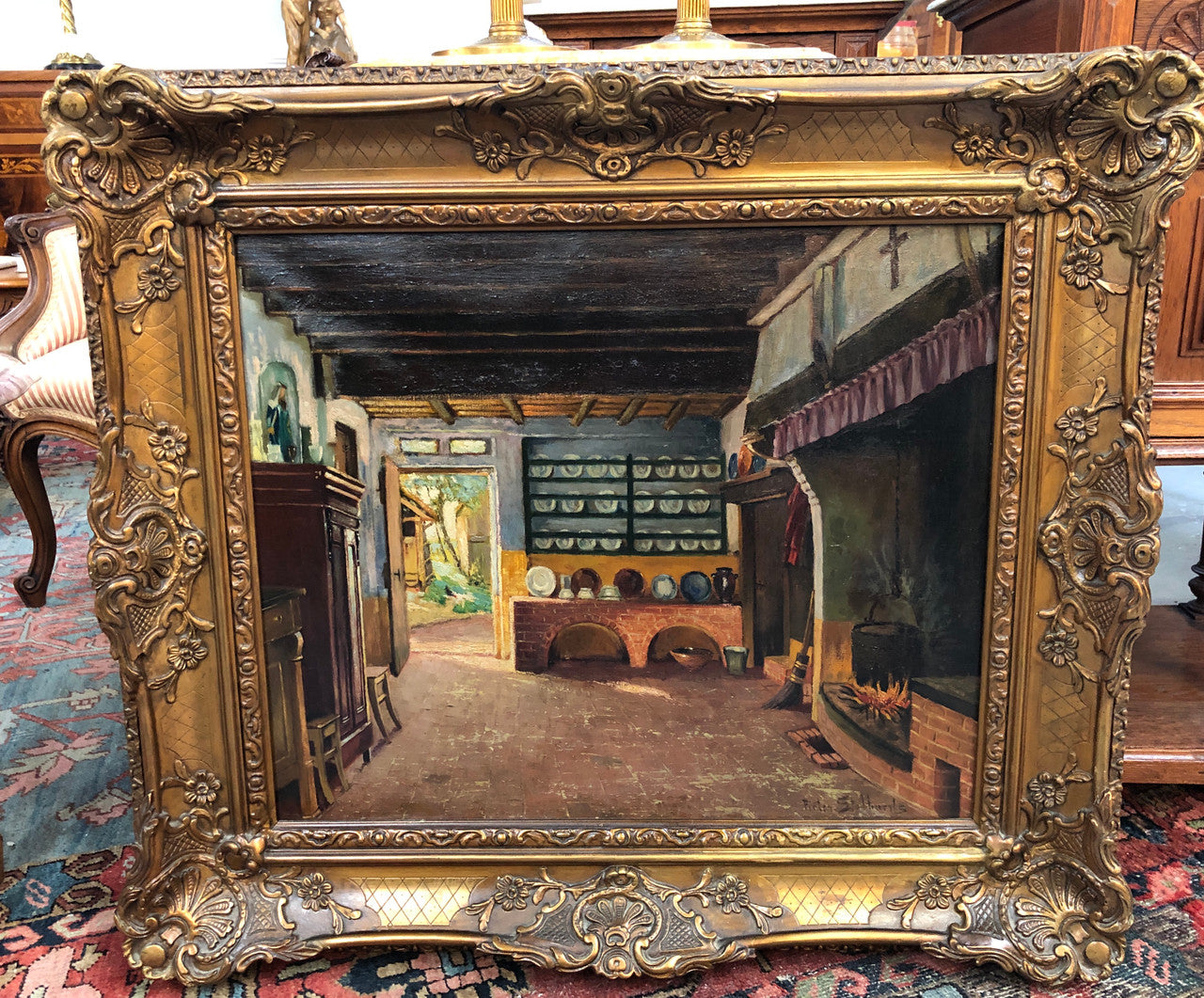 Antique French gilt framed signed oil on canvas of an interior scene in good original condition.