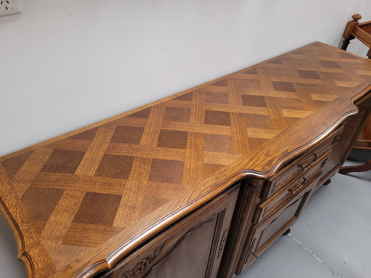 French Oak Louis XV style three door, two drawer, parquetry top sideboard. It has been sourced from France and is in good restored condition.