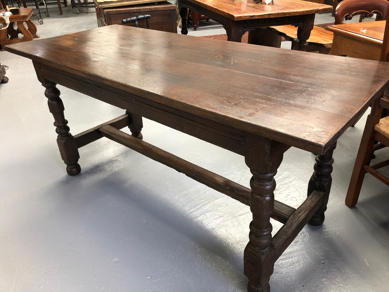 Early 19th Century French Oak petite size dining table. It seats six comfortably and would be ideal for an area with limited space. In very good original detailed condition.