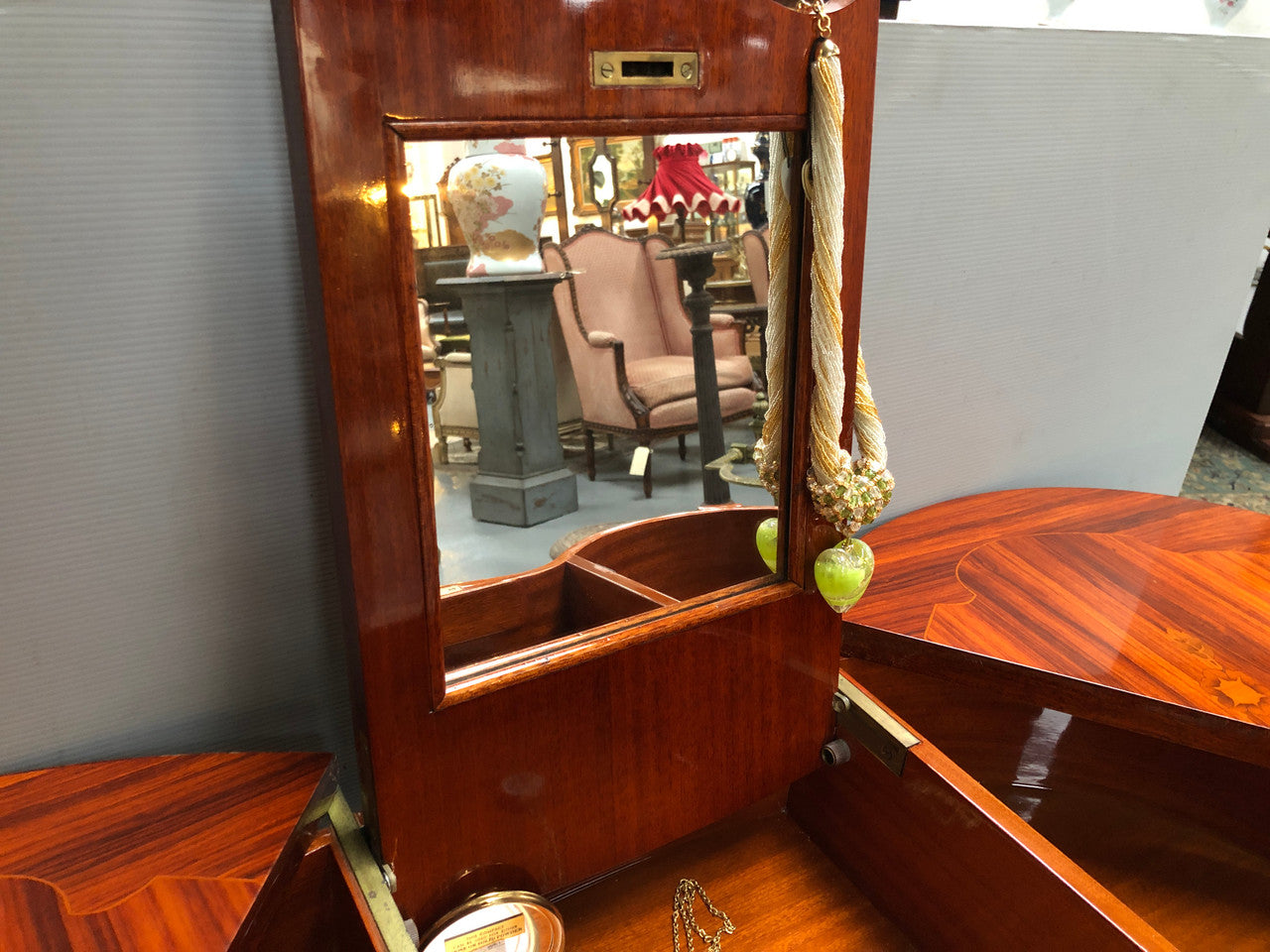 French Mahogany hidden dressing table with beautiful marquetry inlay. In good restored condition. Circa: 1950's