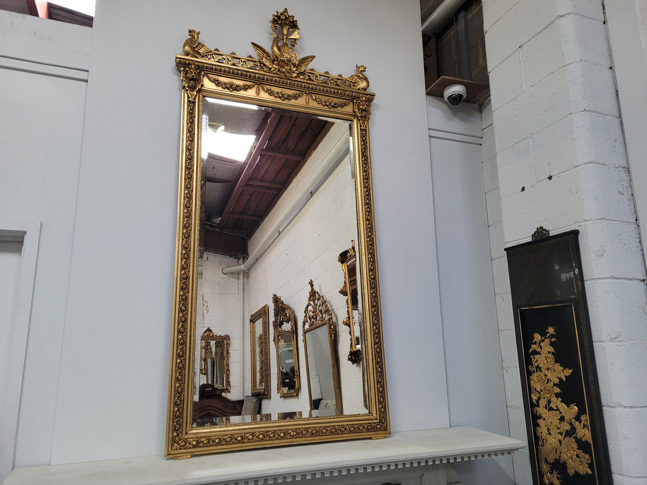 Impressive French Napoleon III water gilded mantle mirror. It is beautifully decorated with allegorical themes and has been sourced from France. In good original detailed condition with original mirror.