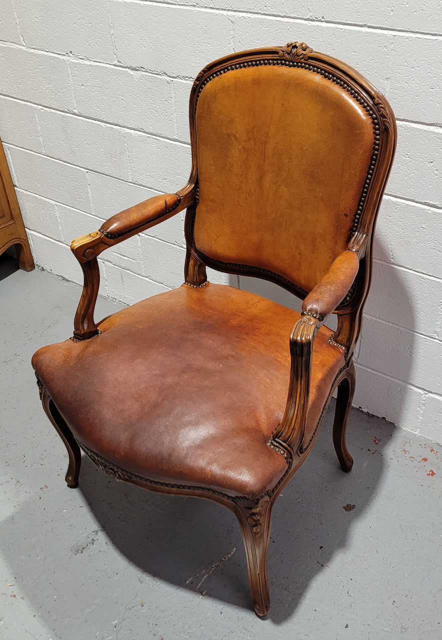 French Walnut Louis XV style desk chair with faux leather upholstery. The upholstery is in good original condition and very comfortable to sit in.