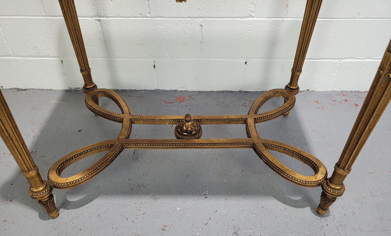 Antique French Louis XVI style gilt center table with a stunning marble top. Featuring stunning ornate carving and it is in great original condition. It has been sourced directly from France.