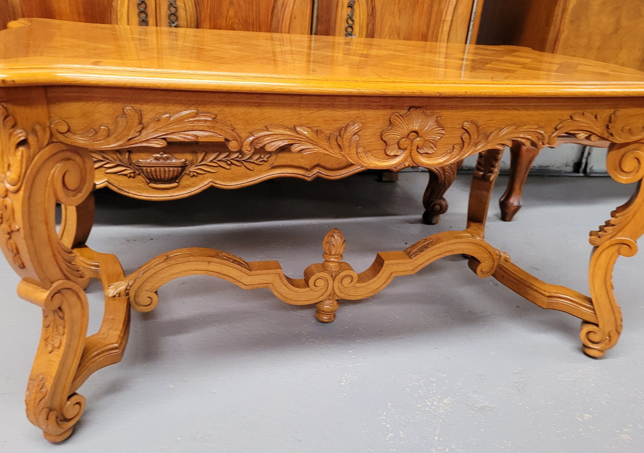 French Oak parquetry top coffee table with decorative carved base. It is in good original detailed condition.