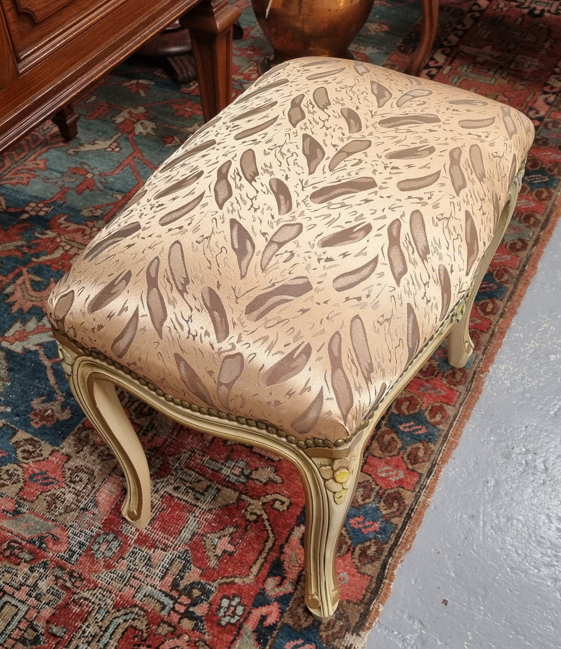 Appealing French Louis 15th style hand painted and gilded stool with good upholstery. In good original detailed condition.