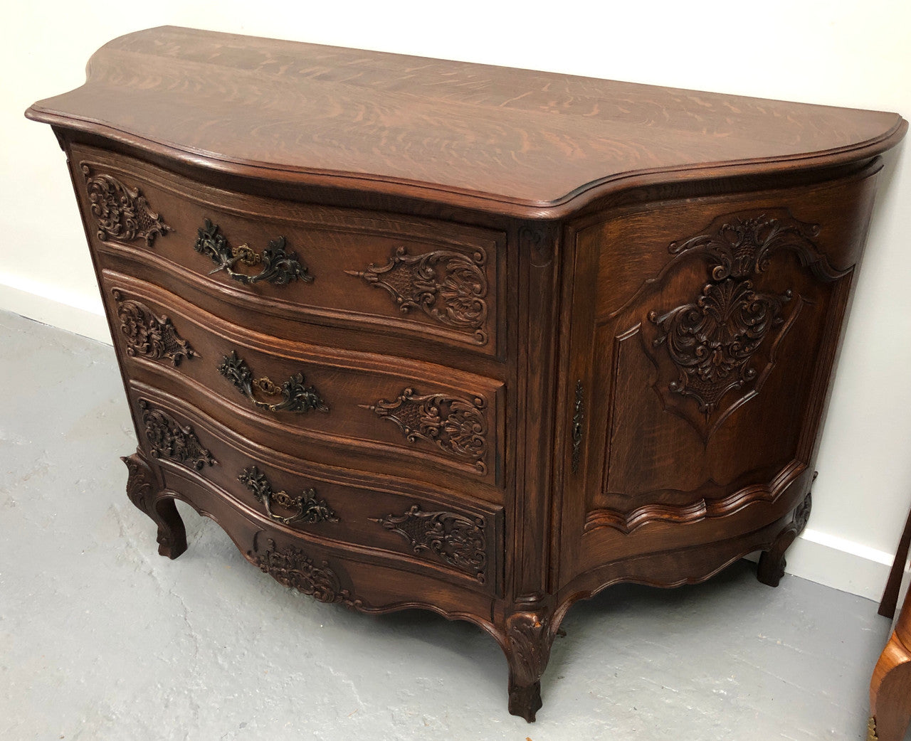 French Louis XV style dark Oak carved, two door and three drawer Commode /side cabinet. Could also be used as a TV cabinet or in the bedroom as storage very versatile. In good original detailed condition.