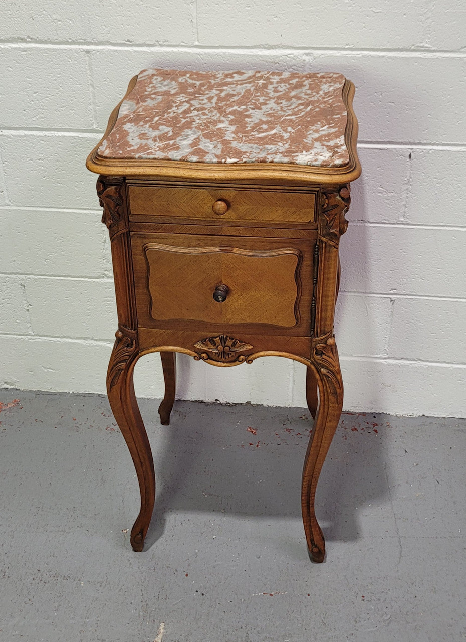 Single French Louis XV style Walnut inset marble top bedside. It has one drawer and one cupboard. It is in good original detailed condition.