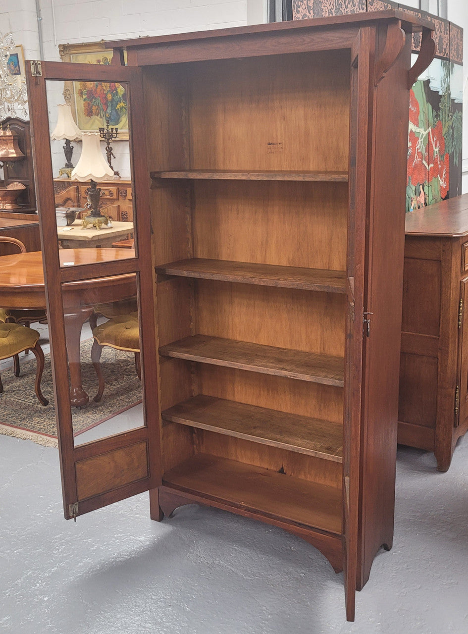Beautiful two door Blackwood bookcase with glass doors and with four fully adjustable shelves. It is in good original detailed condition.