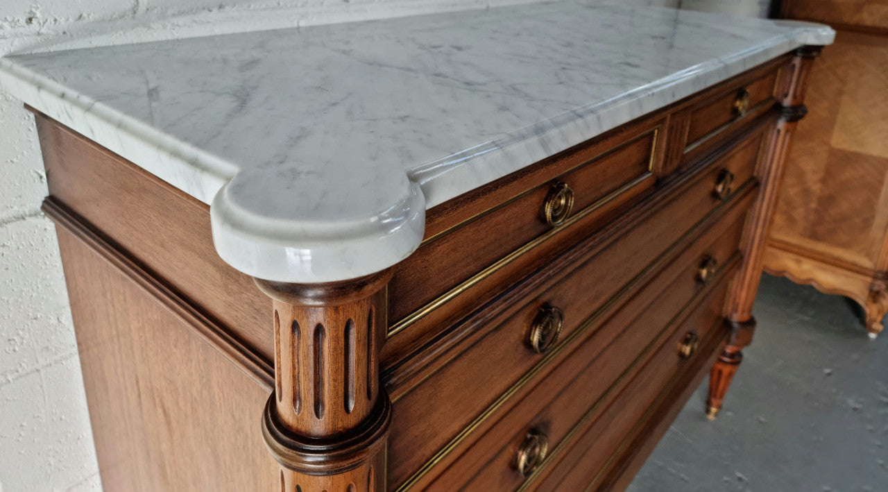 Beautiful French Louis XV Style Marble top five drawer commode. There are five drawers and it has a lovely brass inlay. It is in good original detailed condition.