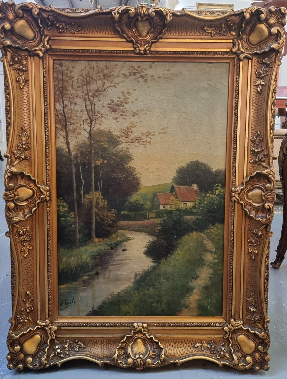 Lovely signed landscape river scene oil on canvas framed in a beautiful ornate frame and in good original condition.