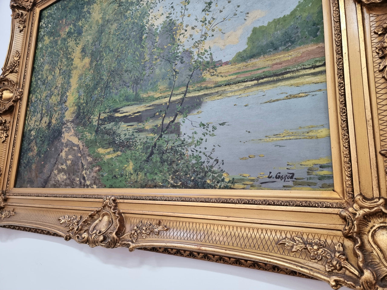 Sourced in France is this beautiful impressionist oil on canvas by "LOUIS GAROT". In a lovely ornate frame, signed and in good original condition.