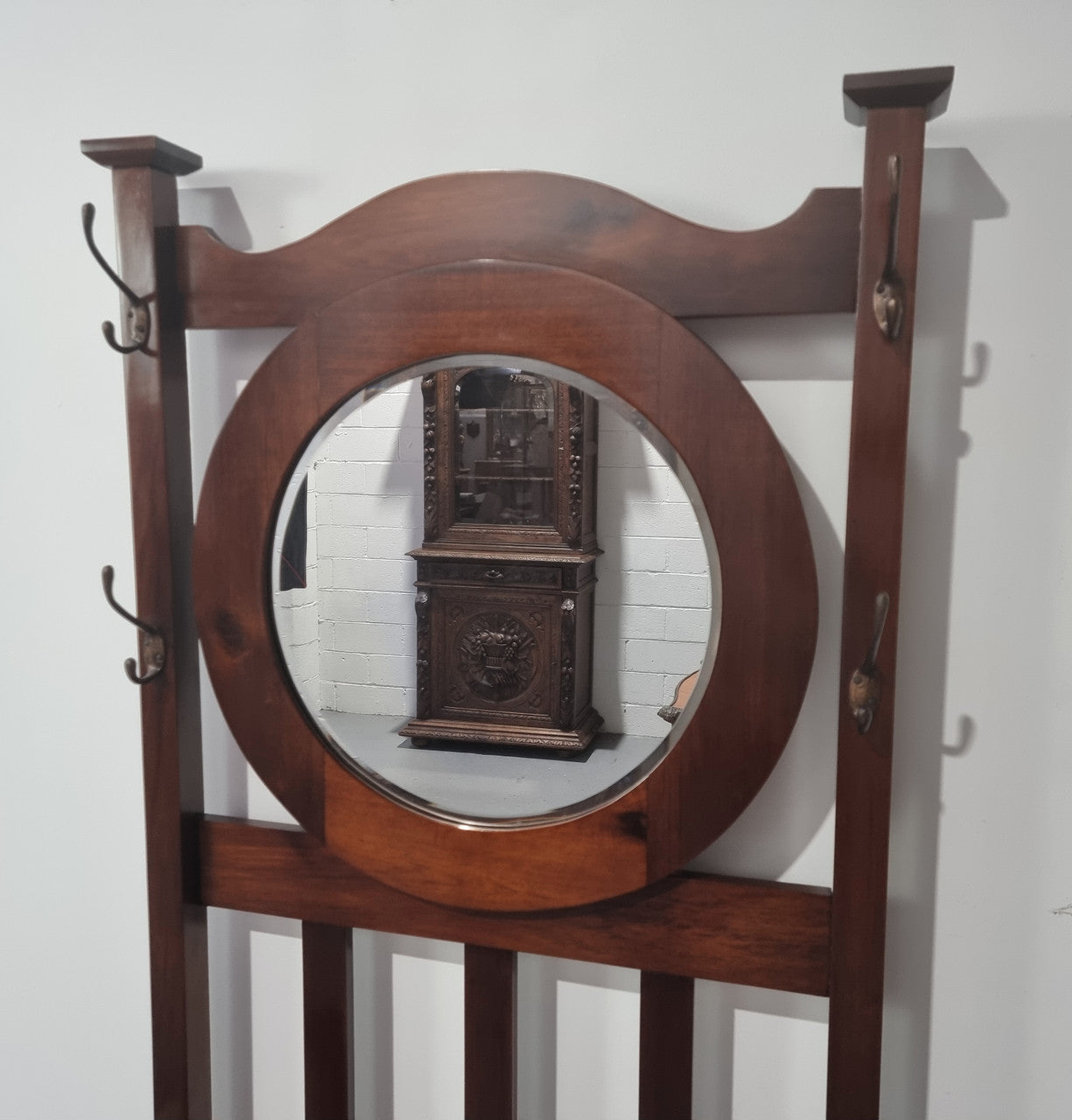 Blackwood Federation hall stand of pleasing narrow proportions. Beautiful round mirror with four lovely hooks and a lift up sit for added storage. In good original condition.