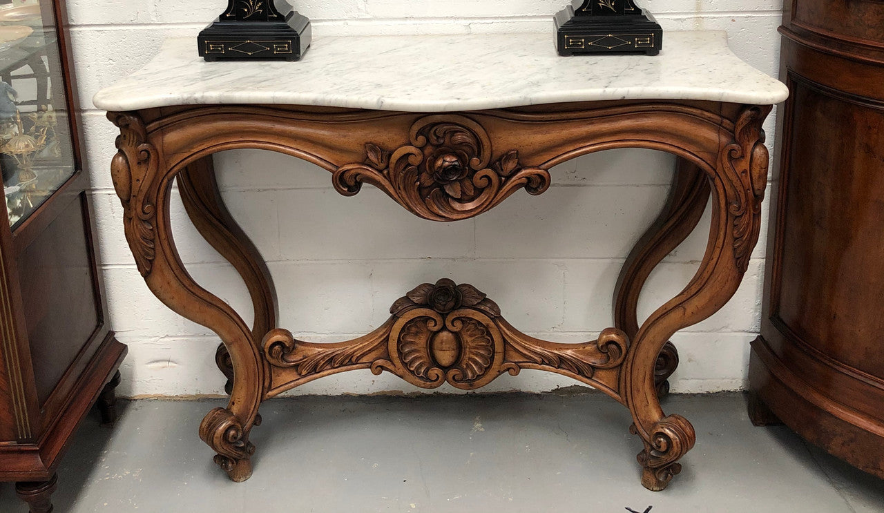 19th Century Louis XV style beautifully carved console table. With detailed ornate carving and a beautiful marble top. In good original detailed condition.