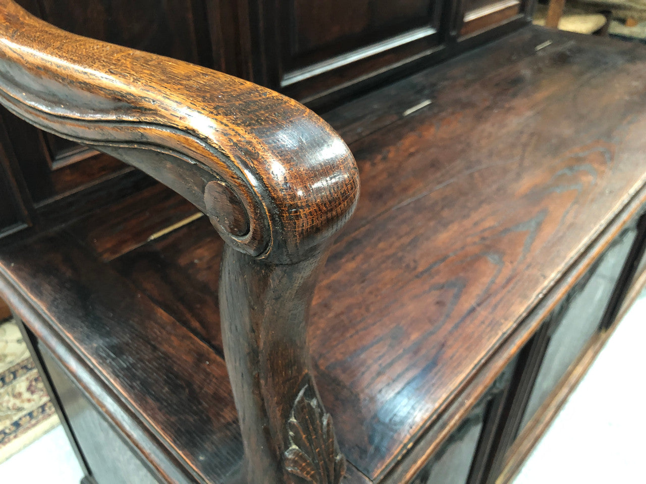 Beautifully carved French Oak hall seat with a lift up lid and storage space inside. In good original detailed condition.