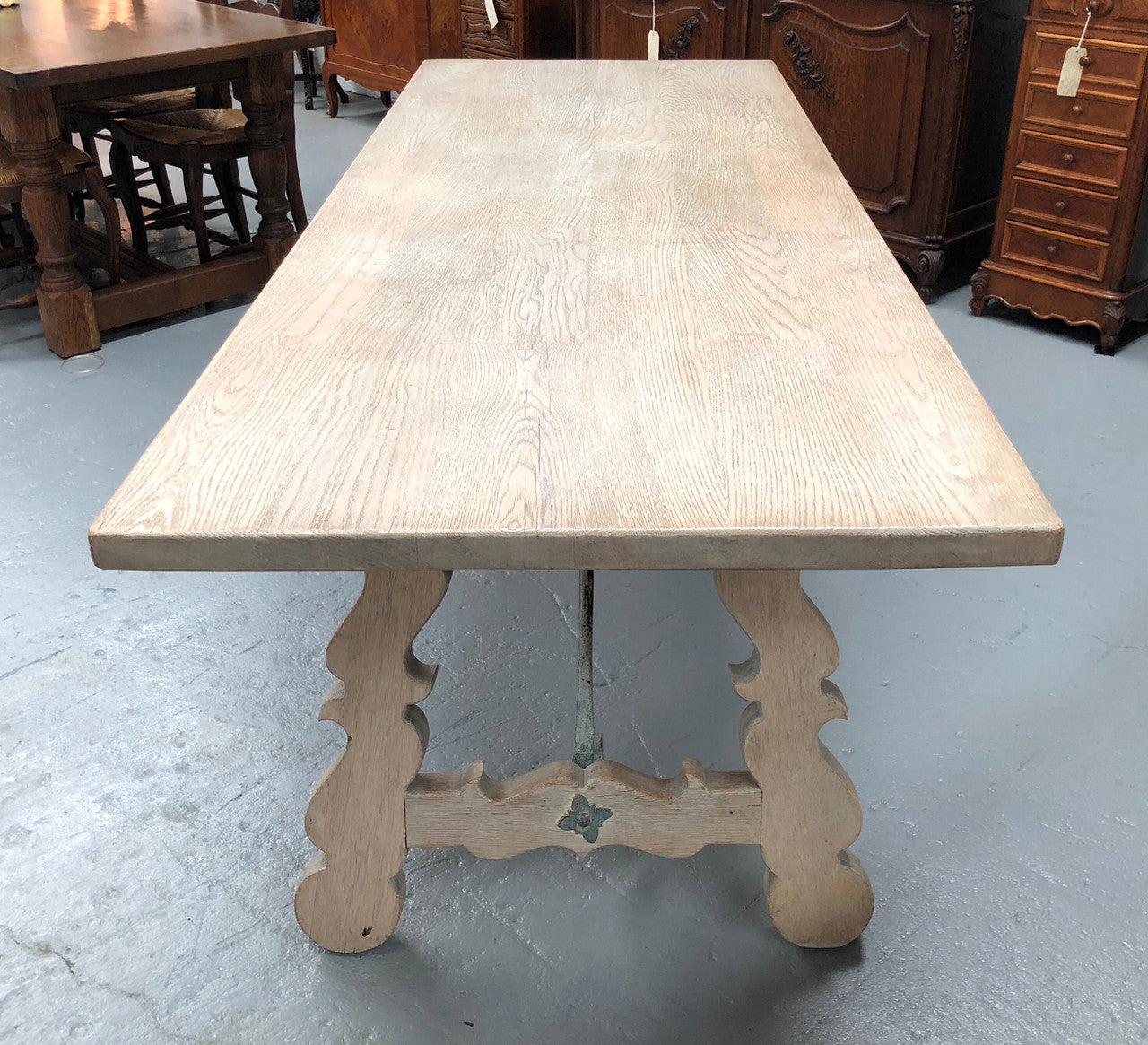 Limed French Oak Farmhouse table with decorative iron base. In good original detailed condition.