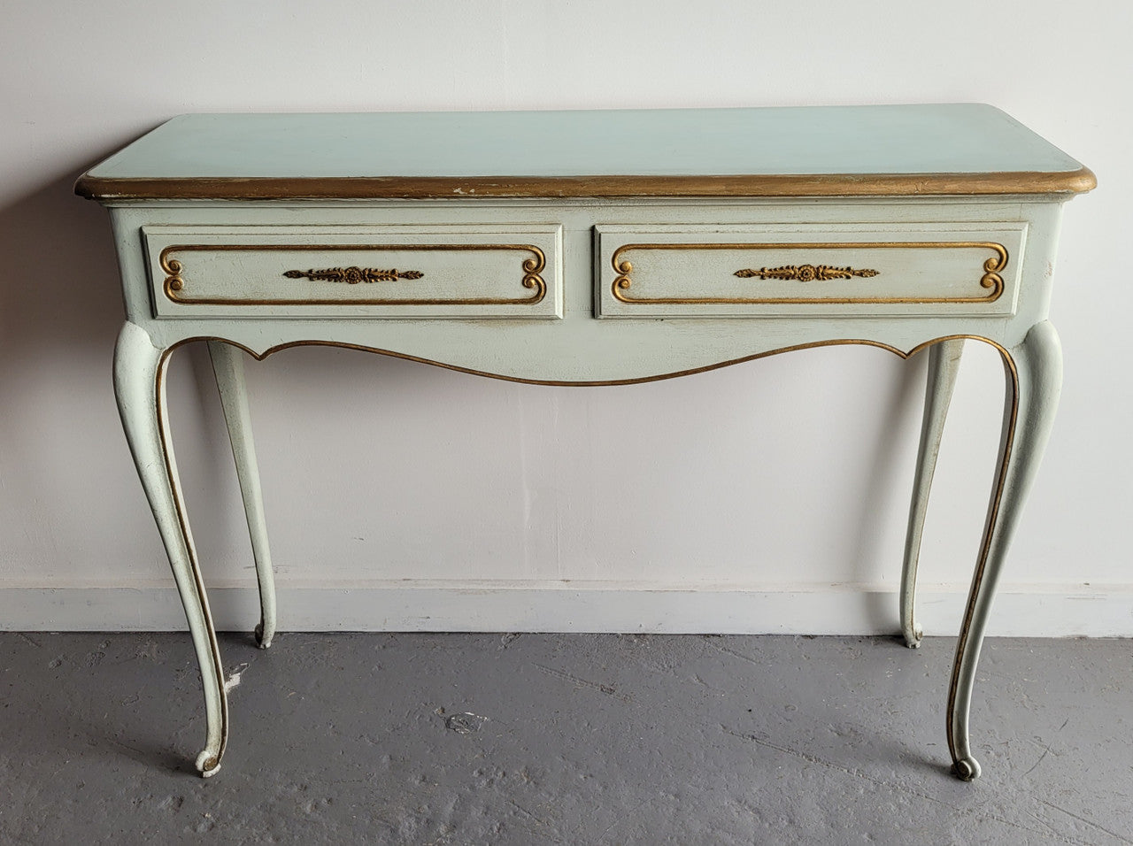 Vintage French Louis 15th style original painted and gilded highlights two drawer console table. It has been sourced from France and is in good original condition.