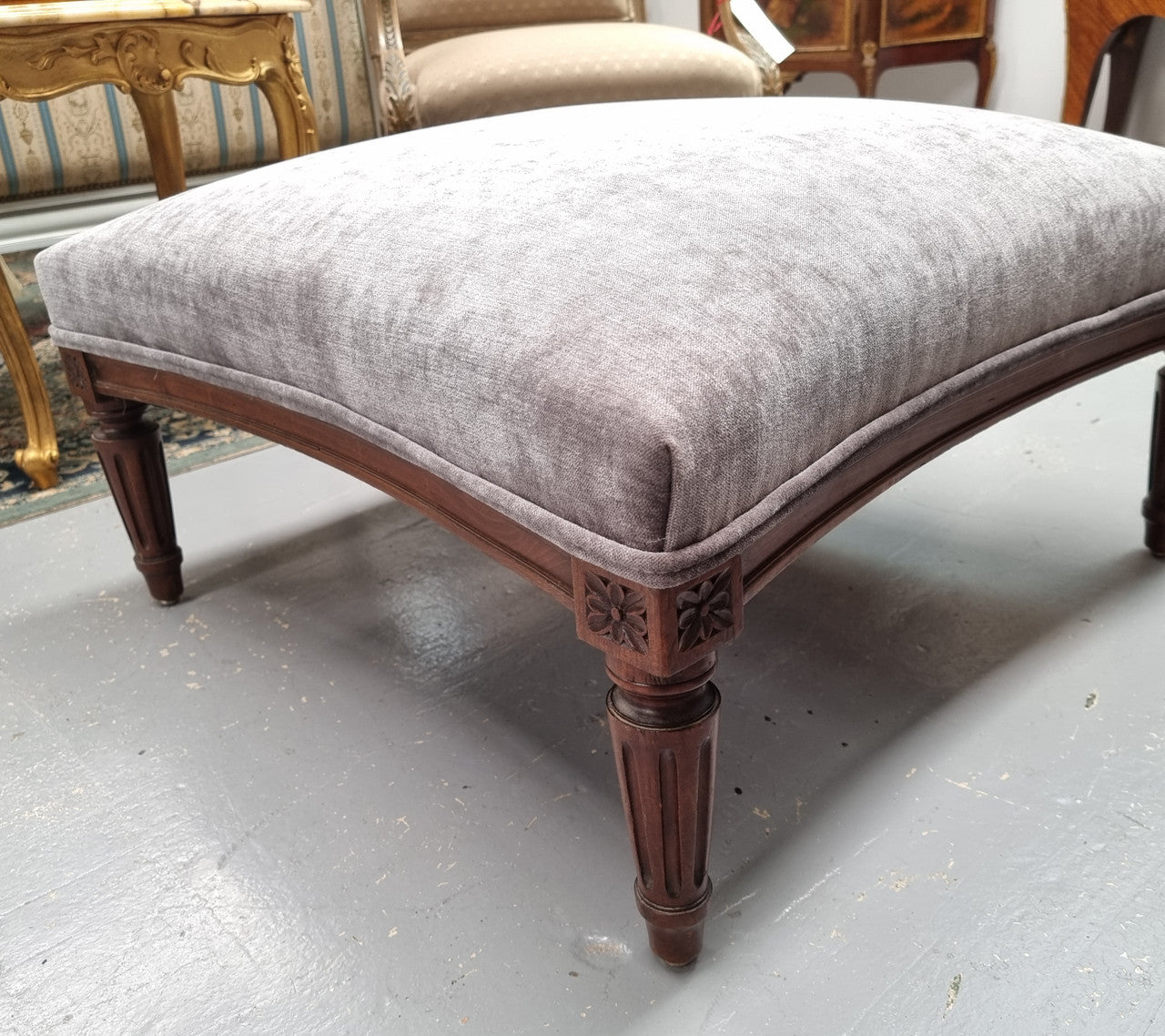 Amazing French Louis 16th Style large walnut footstool with new grey upholstery. Circa: 1900. In good detailed condition.