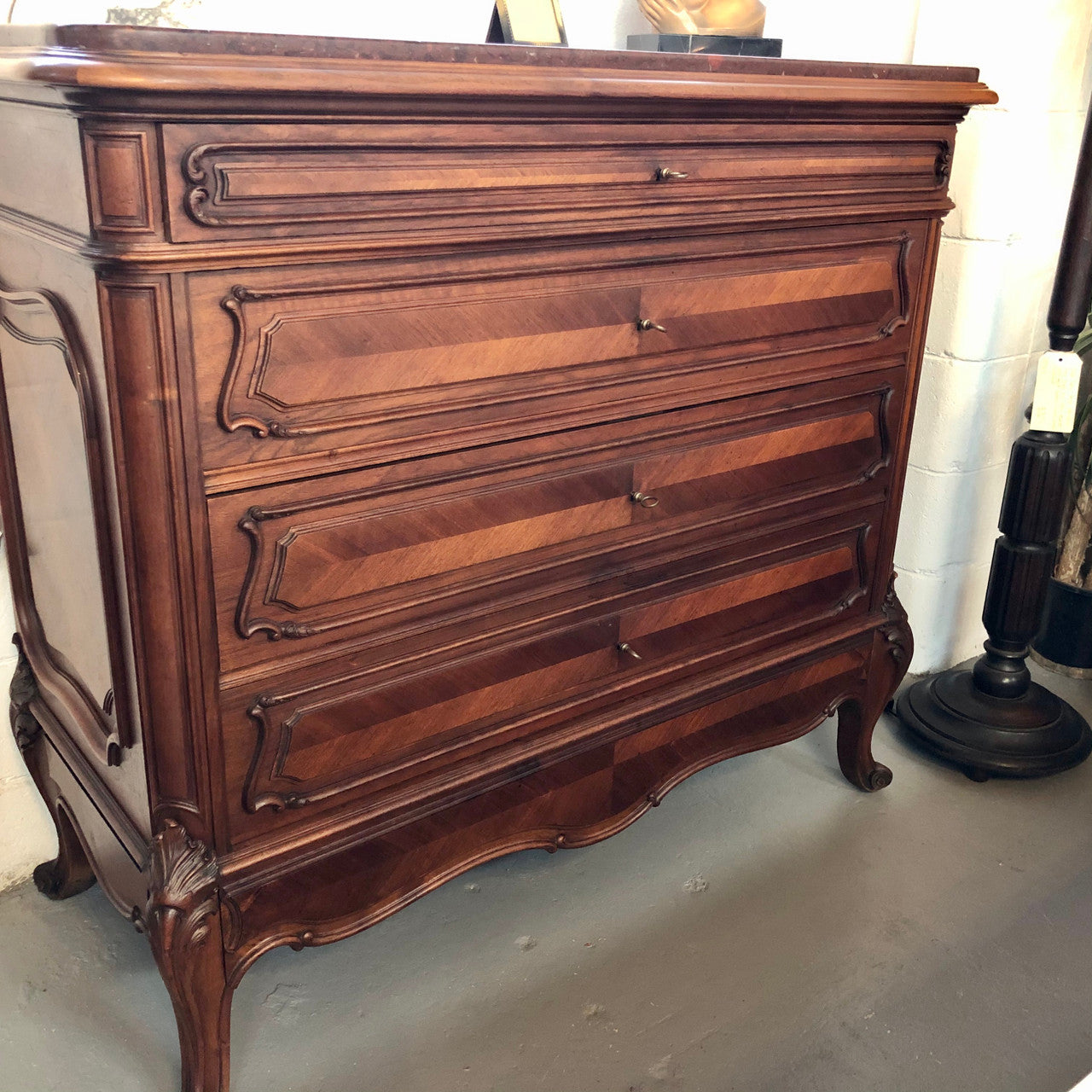 19th Century French Walnut five-drawer marble top commode. In good original detailed condition.