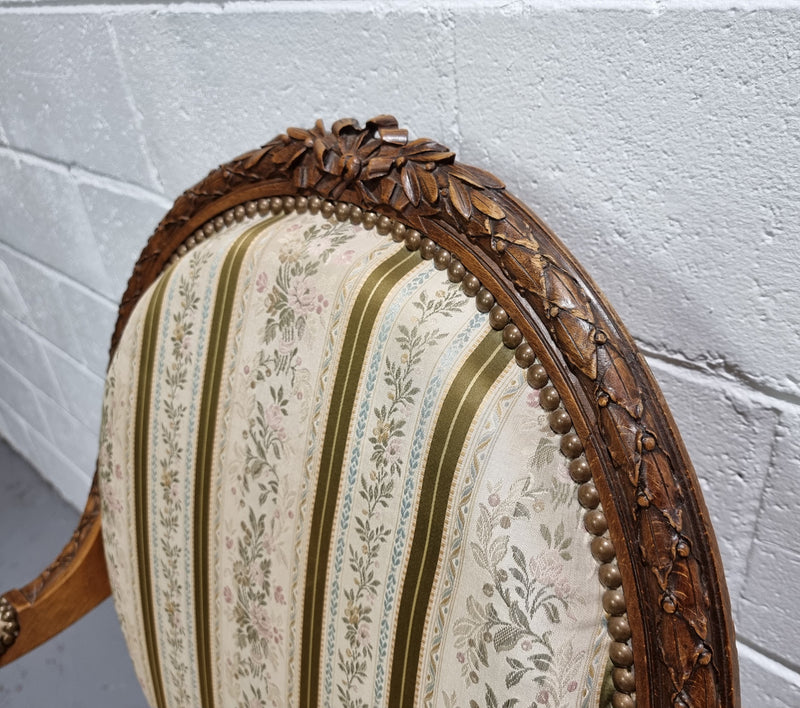 Pair of French Louis XV matching carved armchairs. They are in good overall condition with some slight wear to fabric, please view photos as they help form part of the description.