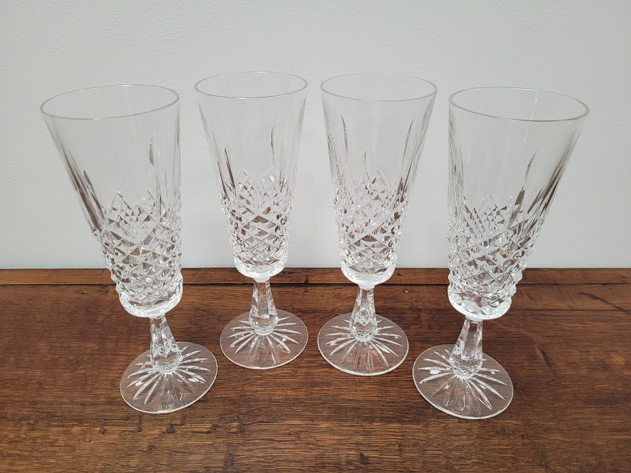 Set of four Waterford “Kenmare” pattern champagne flutes. In good original condition with no chips or cracks.
