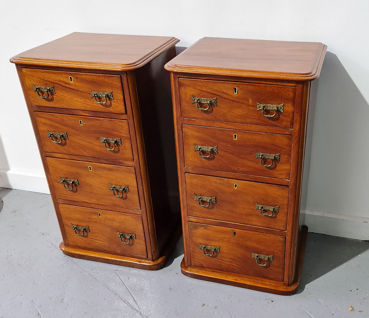 Pair of English Victorian Mahogany bedside drawers. In good original detailed condition.