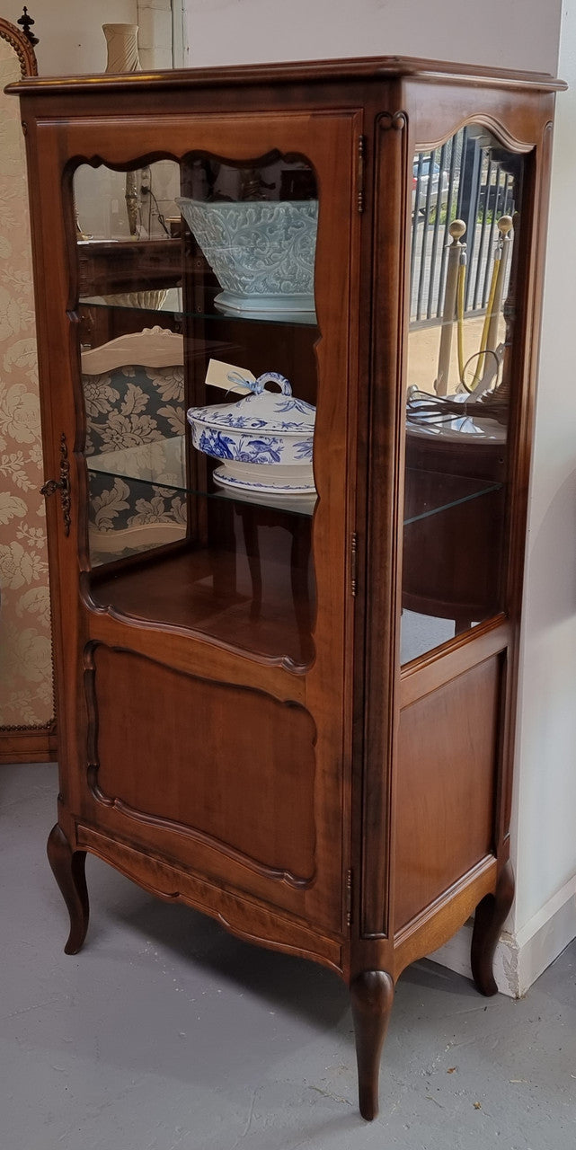 Petite French Louis XV style Walnut display cabinet with two glass shelves that can be adjusted and added storage at the bottom . In very good original detailed condition.