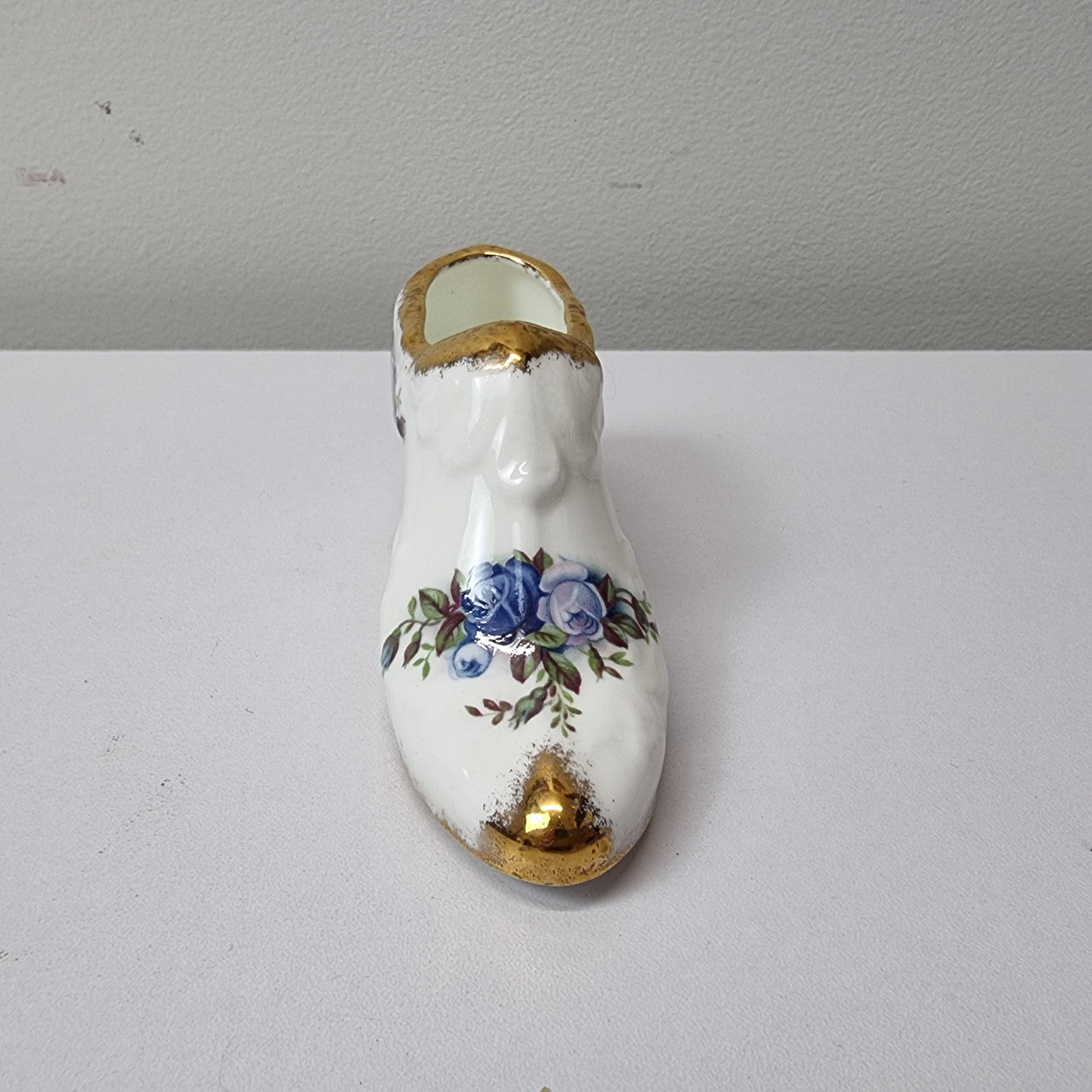 A lovely pair of Royal Albert China shoes in good original condition. Stamped on the sole 'Moonlight Rose: Royal Albert Bone China, England ©1987.