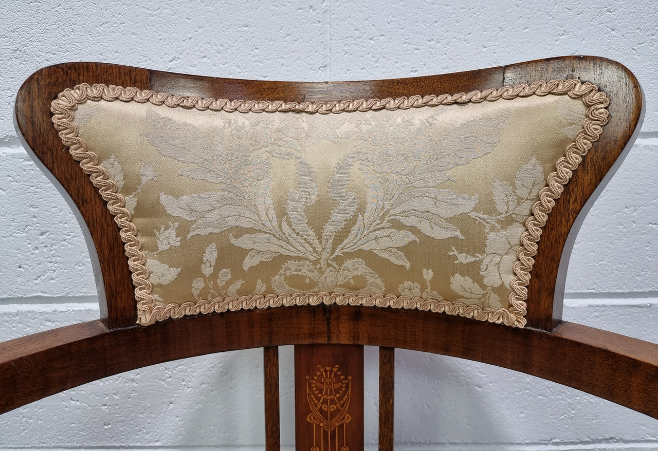 Charming Edwardian inlaid walnut upholstered armchair. In good original condition.