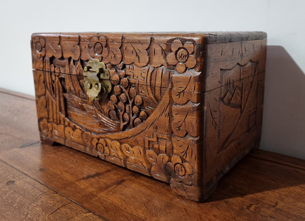 Small Chinese carved camphor wood jewellery box. It is in original condition.