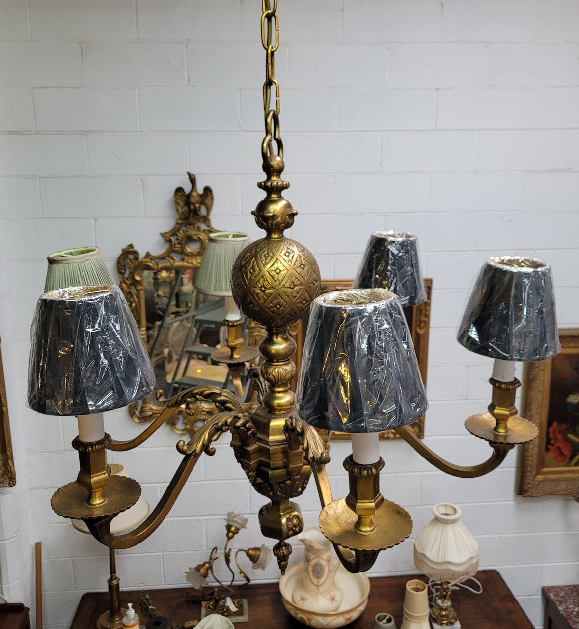 Stunning six arm French bronze chandelier. It can be used with or without shades. It has been fully rewired to Australian standards. It is in good original detailed condition.