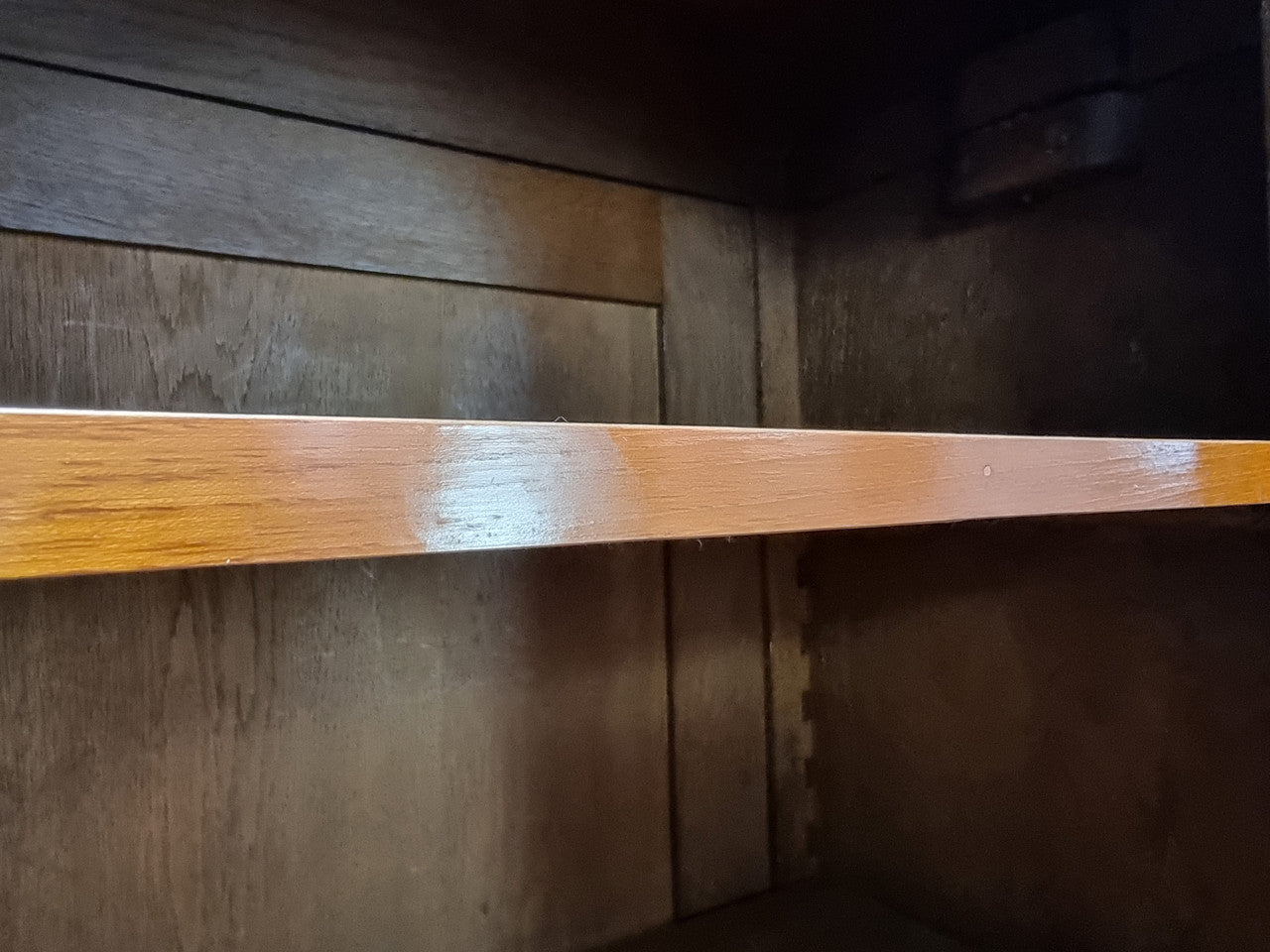 Antique Mahogany two door Biedermeier style bookcase with four fully adjustable shelves and a drawer at the bottom. The two wooden finials at the top are easily removed for a different look of desired. In good original detailed condition.