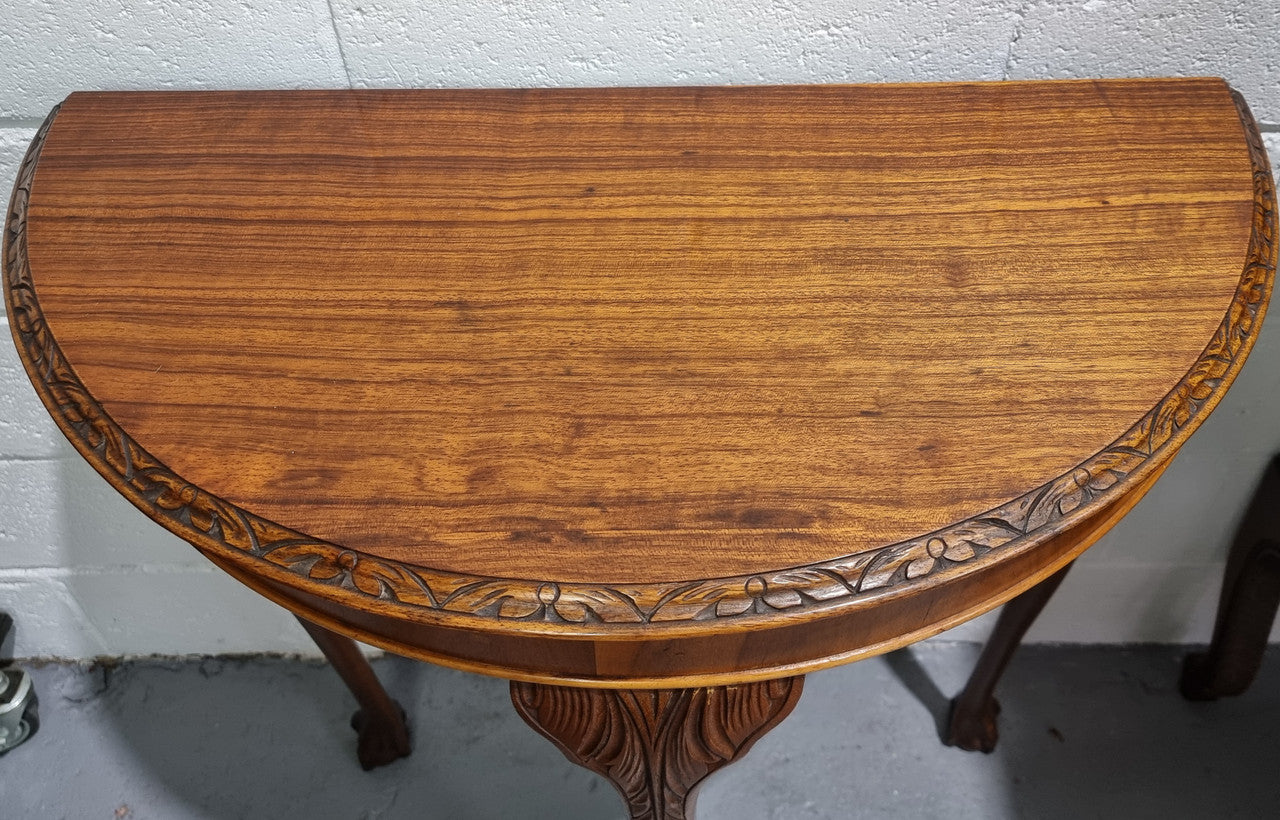 Chippendale style half round hall table. It is in good original detailed condition.