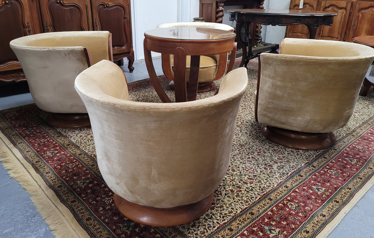 Four stunning original Art Deco Tulip shaped salon lounge chairs made specifically for the Hotel Le Malandre, Belgium in the 1930’s. They are marked with a metal tag “Hotel Le Malandre Modele Depose” Burl Walnut, Walnut and gold coloured velvet upholstery and rest on a thick wooden circular base it has been sourced in France and in good original condition. Included in the set is the accompanying Art Deco Walnut with glass top side table also made for Hotel Le Malandre and marked with the metal tag. Absol