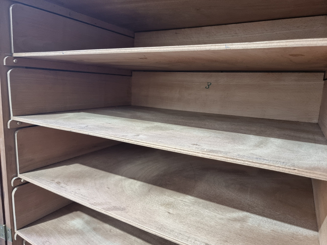 French Henry II style Walnut linen storage cupboard with nine pull out shelves. This piece could be very functional for a range of different purposes including shoe storage. It is in good original detailed condition, please note the door lock no longer functions and opens by pulling the door.