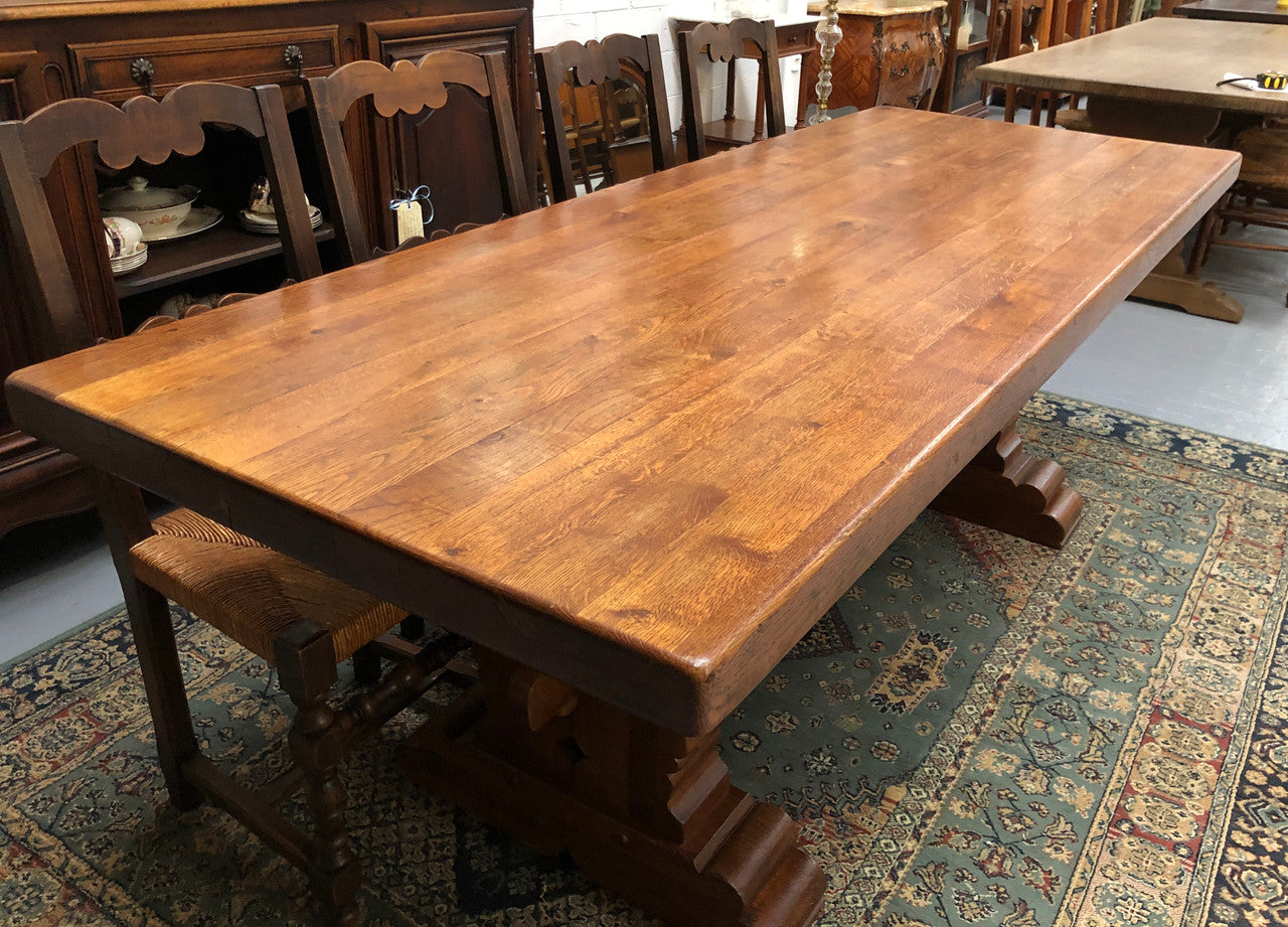 French Farmhouse table with a beautiful thick plank top and stretcher base. Can seat 8-10 people comfortably and is in good original detailed condition.