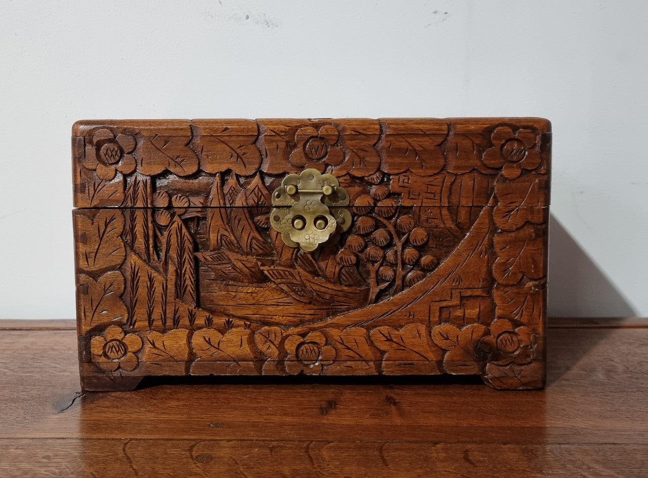 Small Chinese carved camphor wood jewellery box. It is in original condition.