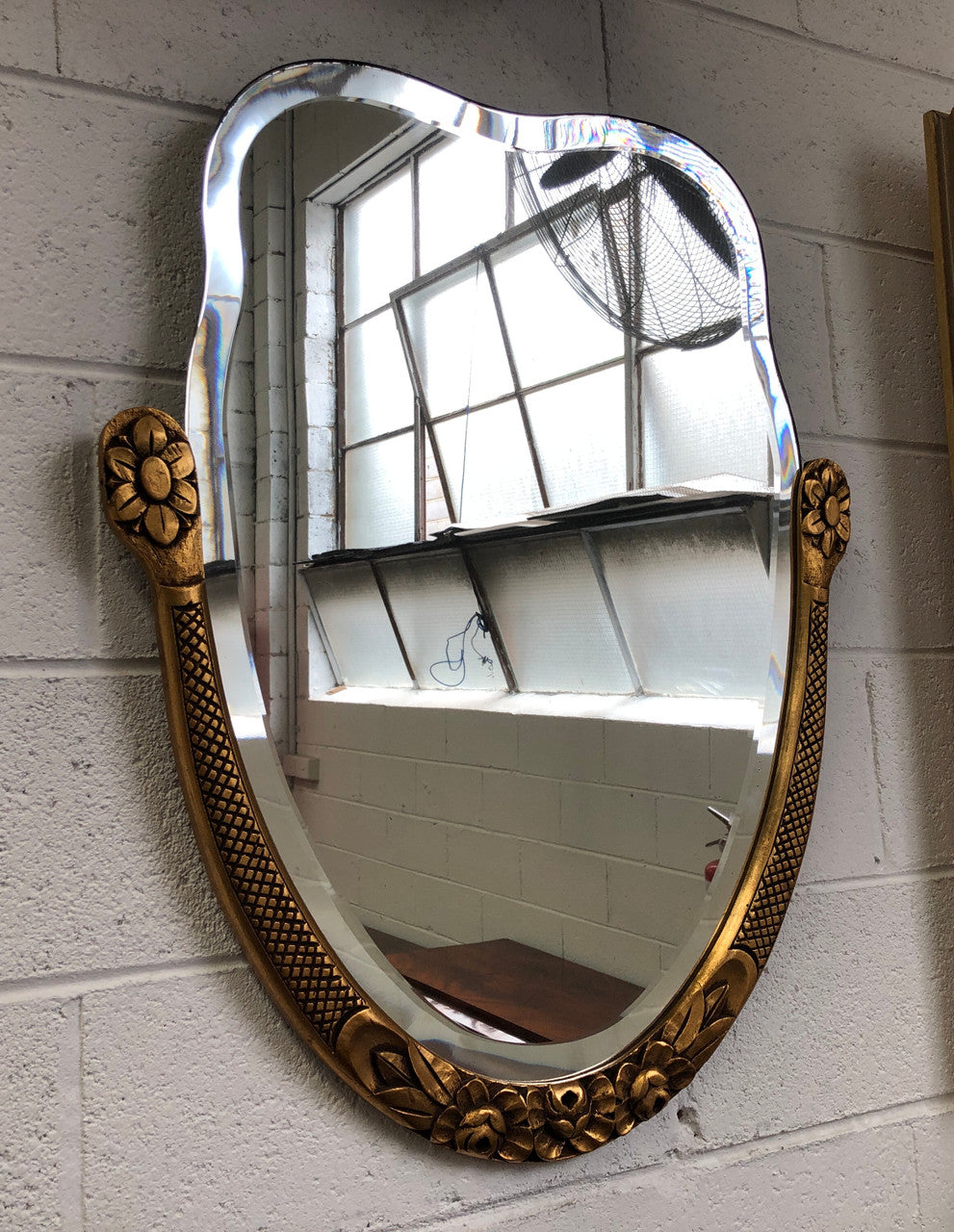 Beautiful French decorative Art Deco giltwood wall mirror with lovely floral detail. Contains its original mirror and is in good original condition.