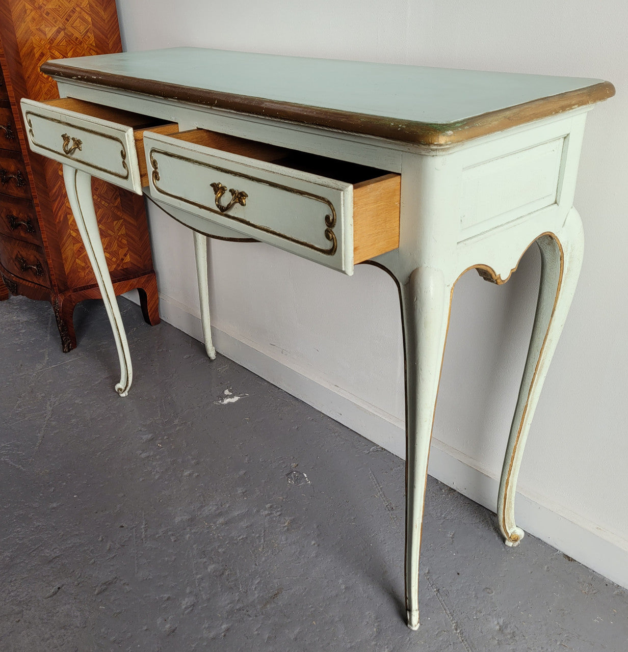 Vintage French Louis 15th style original painted and gilded highlights two drawer console table. It has been sourced from France and is in good original condition.