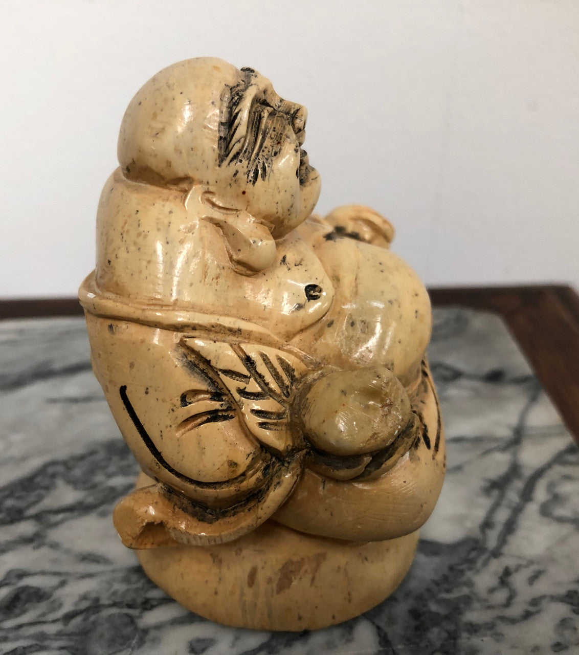 Vintage carved statue of Smiling Buddha