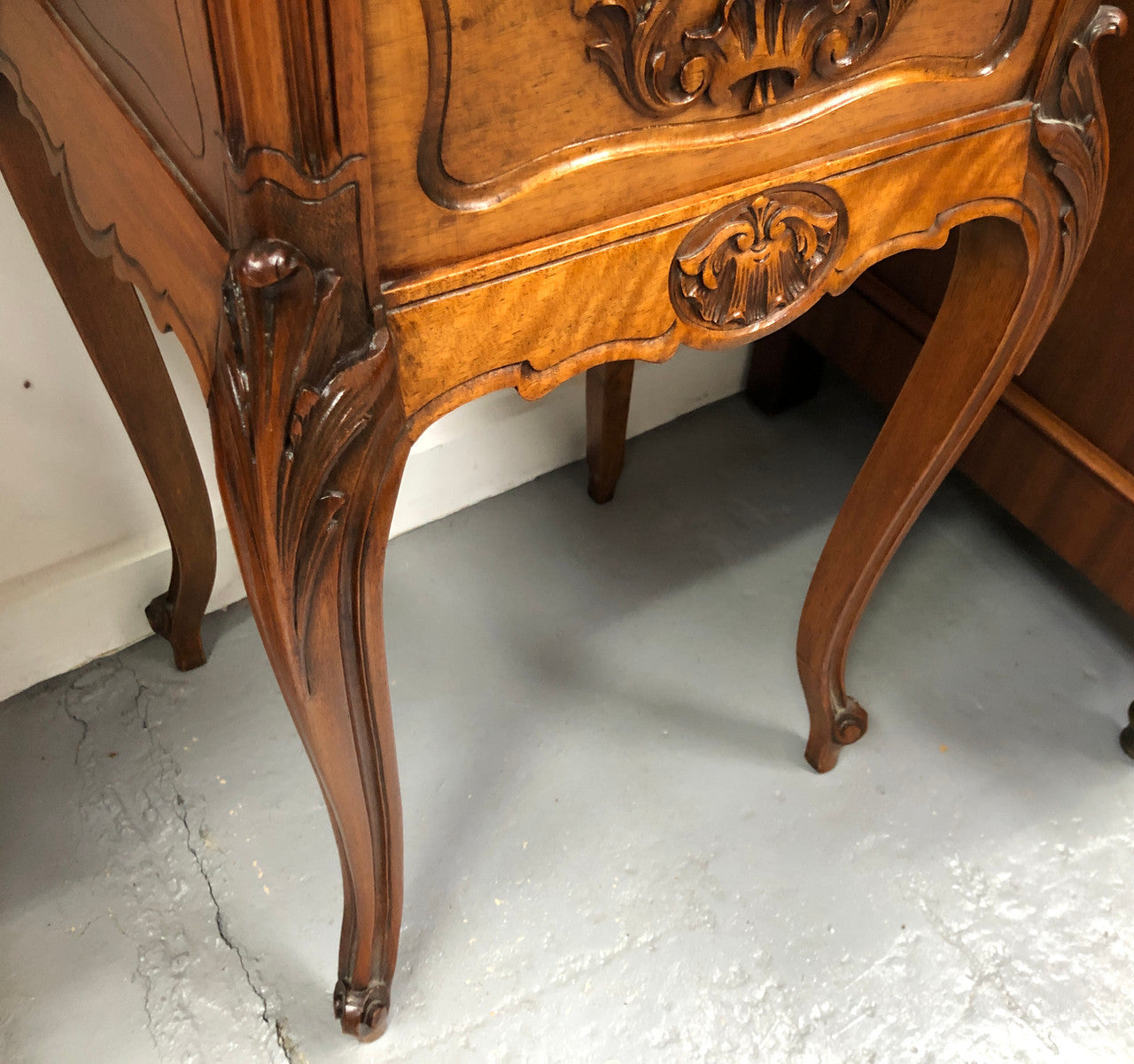 Single French carved bedside with inset marble top. It has beautiful carving and a drawer and cupboard for storage. In very good original detailed condition.