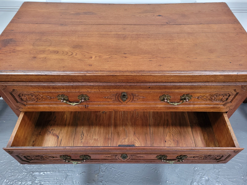 French Louis 15th style large three drawer chest featuring carved drawers. It has been sourced from France and is in good original detailed condition.