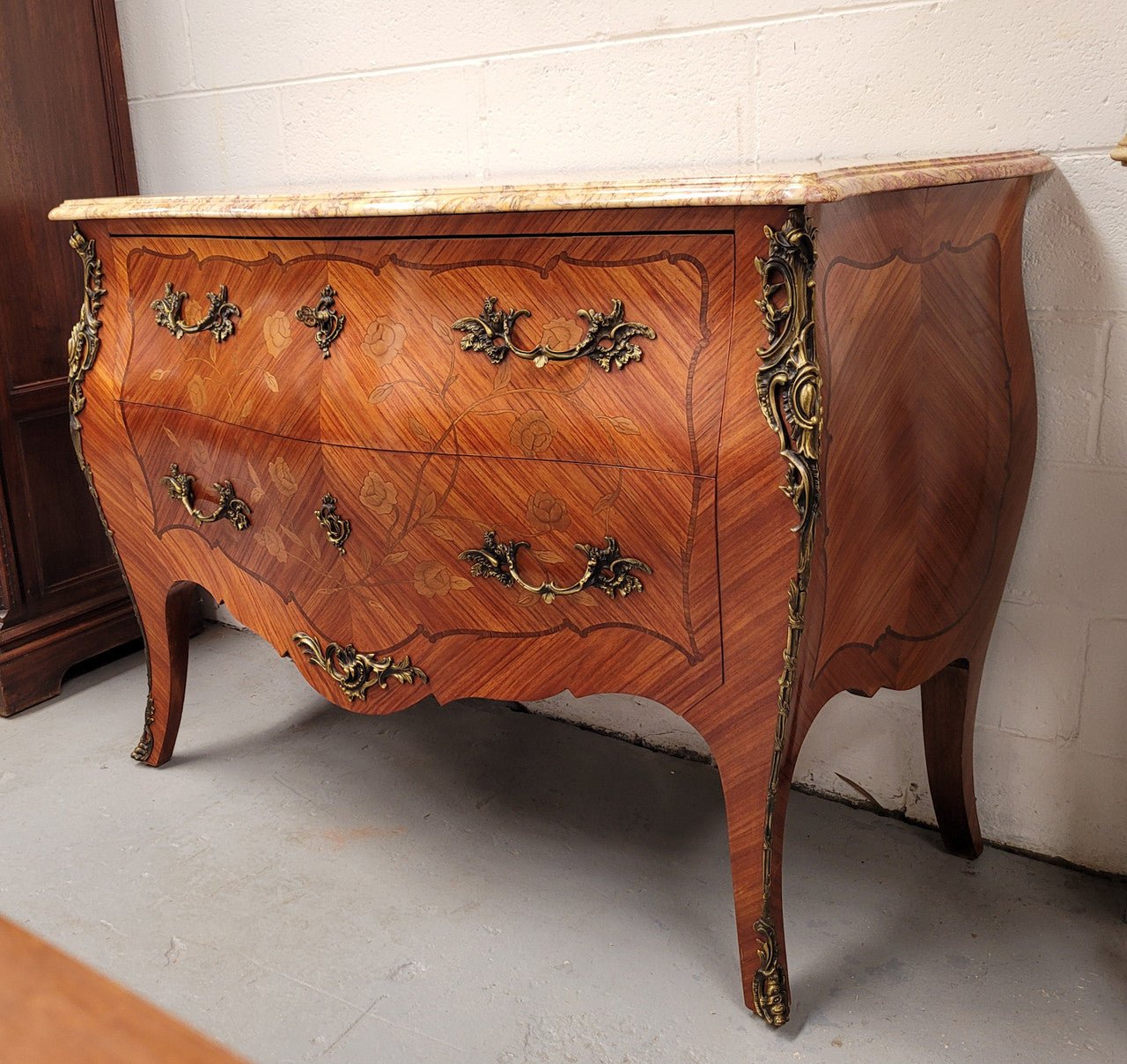 Stunning Louis XV style two drawer marquetry inlaid marble top commode. Made from Kingwood and has highly decorative beautiful ormolu mounts. It has been sourced from France and is in good original detailed condition.