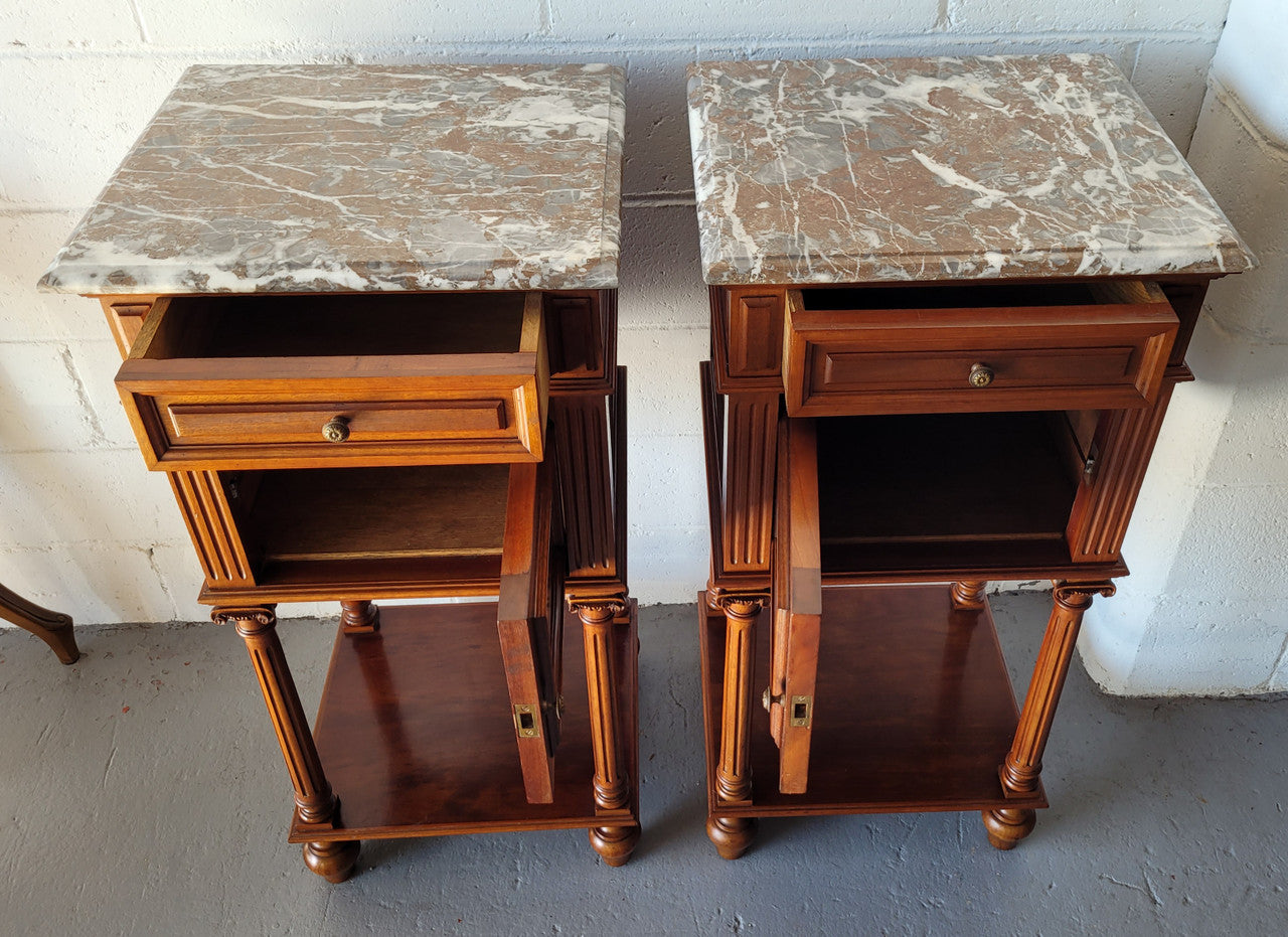 Pair of Henry II style Walnut bedside cabinets with a marble top. Circa 1920s and in good original condition.